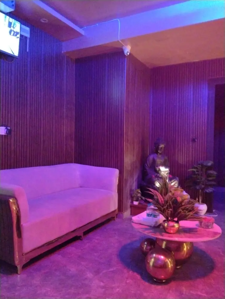 Relaxation lounge with Buddha statue at Lavya Thai Spa