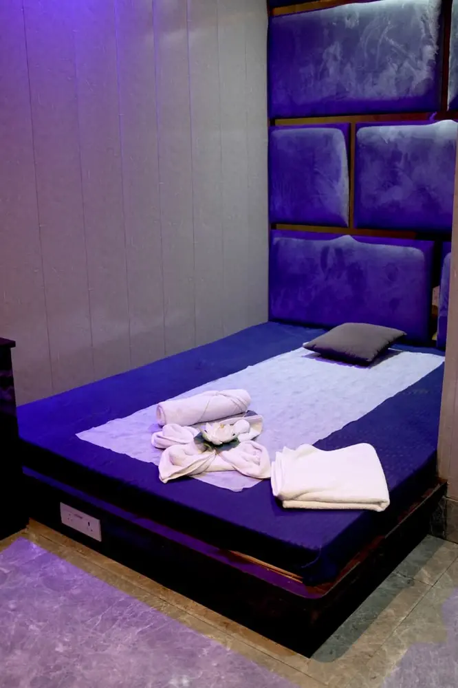 Treatment bed set up with towels at Lavya Thai Spa